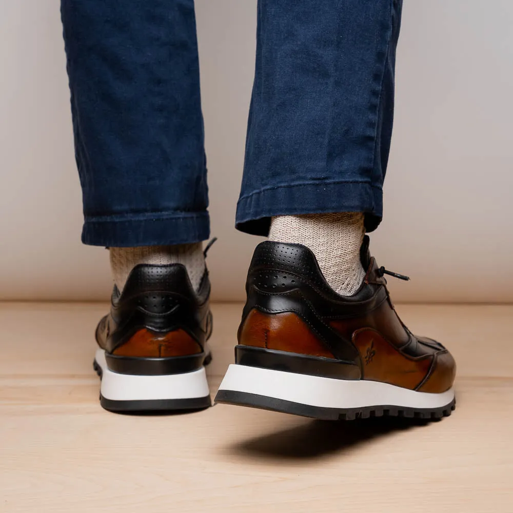 Sure, I understand that you want to optimize the title of the e-commerce product. How about this for the revised title: Hand-Finished Cognac and Black BRAVO Trainer - 65-355-BRN